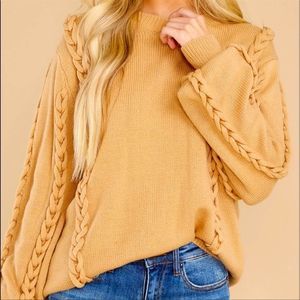 Camel neutral sweater with beaded details.